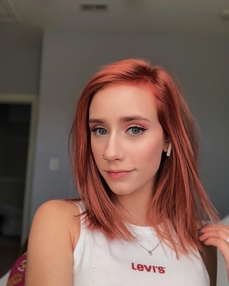 A picture of Tess Reinhart in her Red hair.